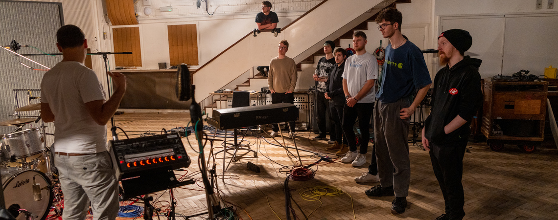 Students in a recording studio on a field trip to Abbey Road Studios in London
