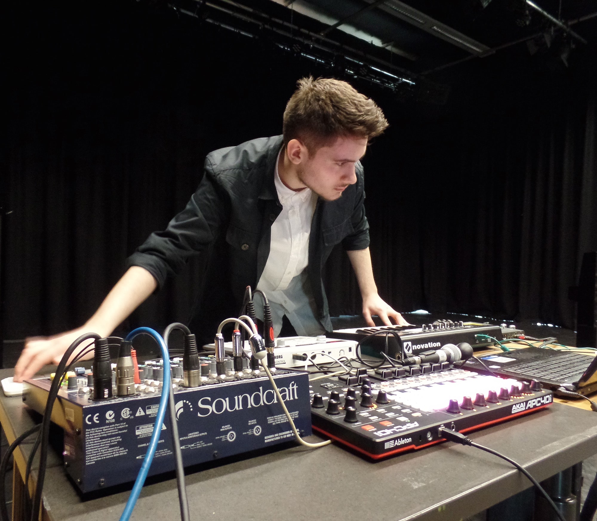Student using a sound craft audio mixing desk