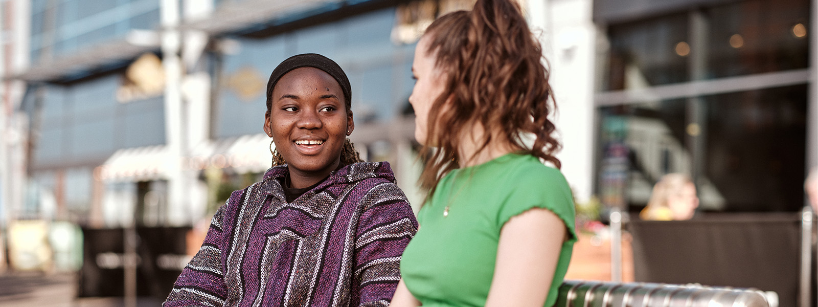 Two students sat talking